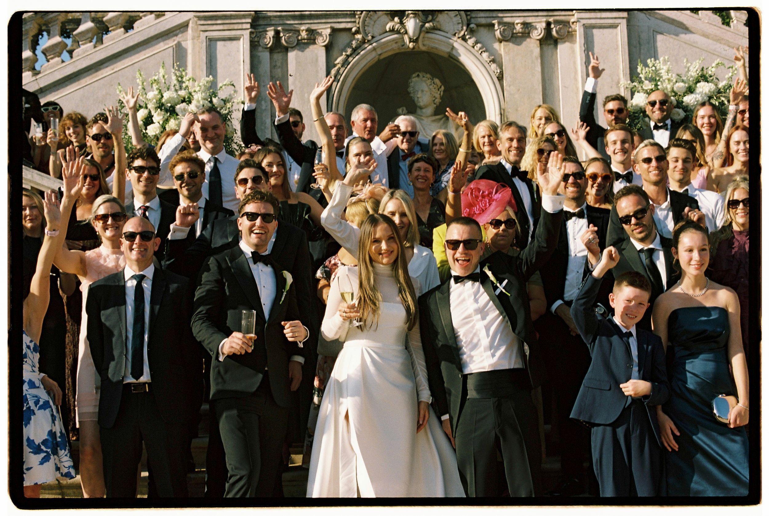 Analog candidi group picture of guest celebrating with bride and groom at Lisbon's Vandelli Botanical Gardens