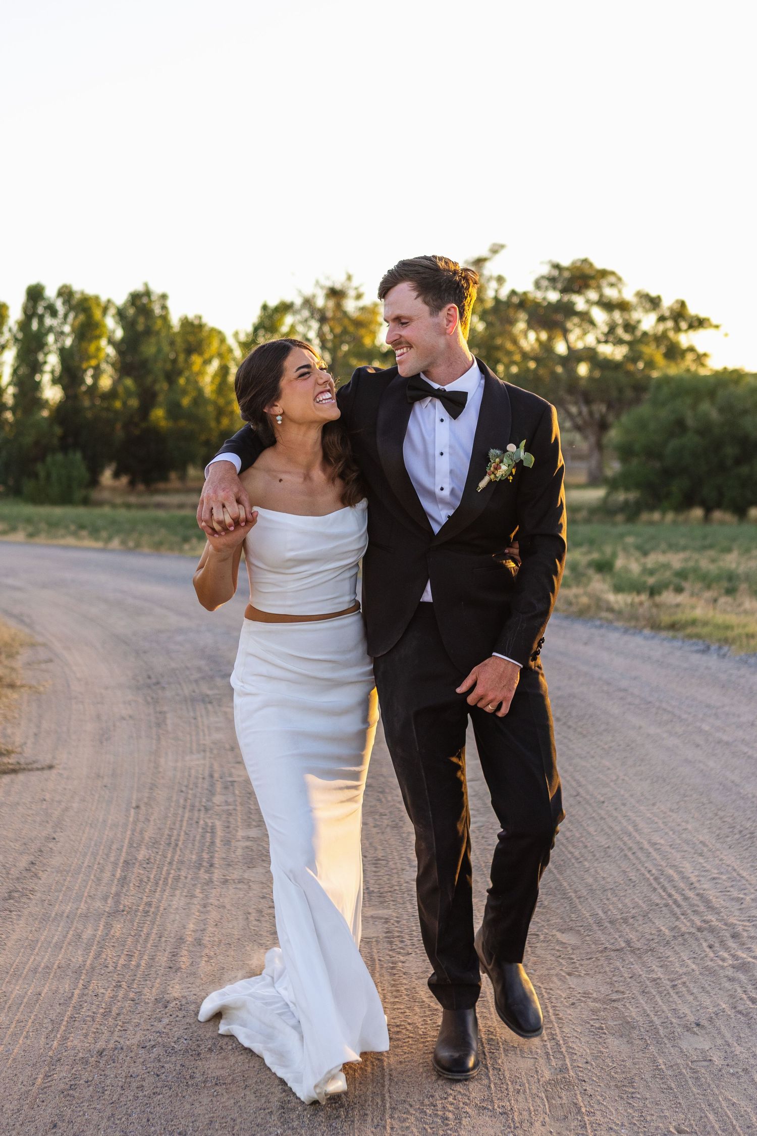Groom embracing bride at country NSW wedding