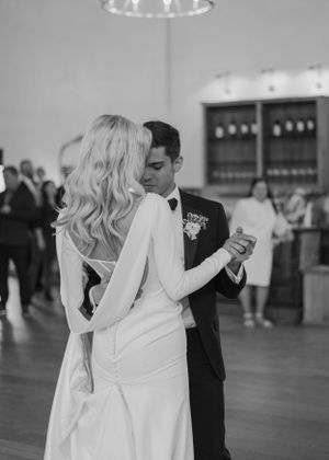 Couple sharing an intimate dance moment at their wedding reception.