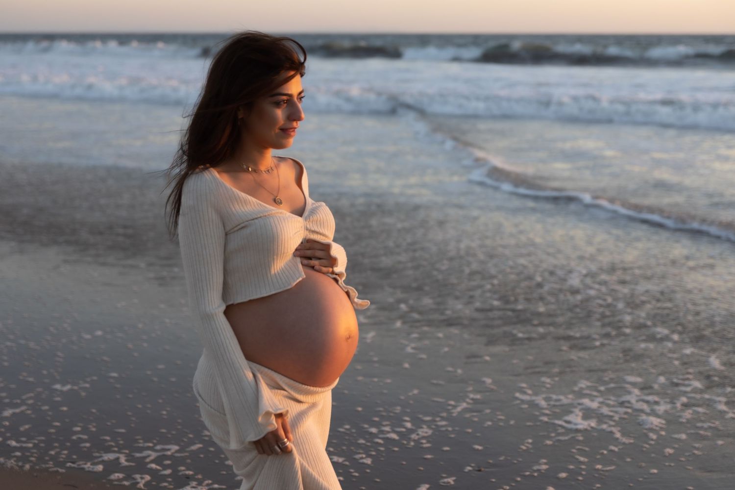 Golden hour maternity photography capturing a glowing mother-to-be.