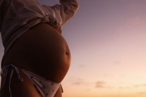 bump image during sunrise maternity session in christchurch