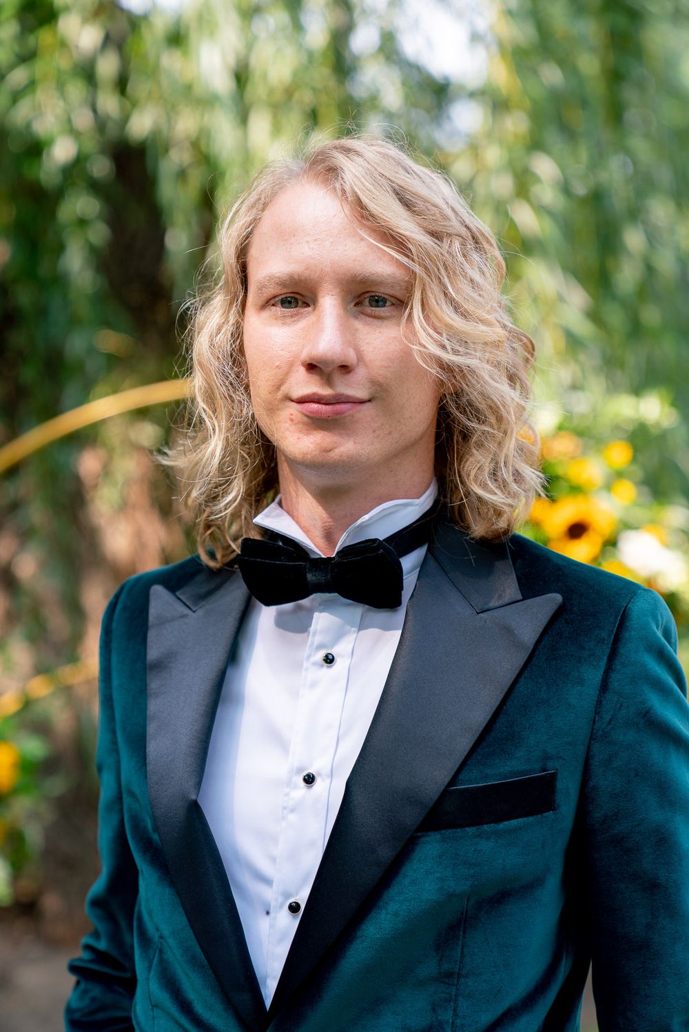 green suit wedding on a groom with dark bow tie