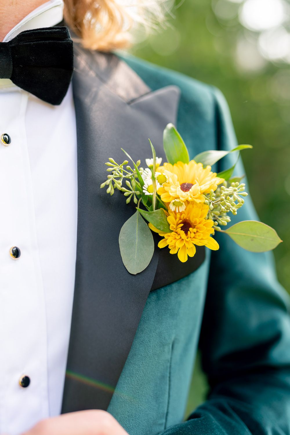 yellow flower in groom jacket