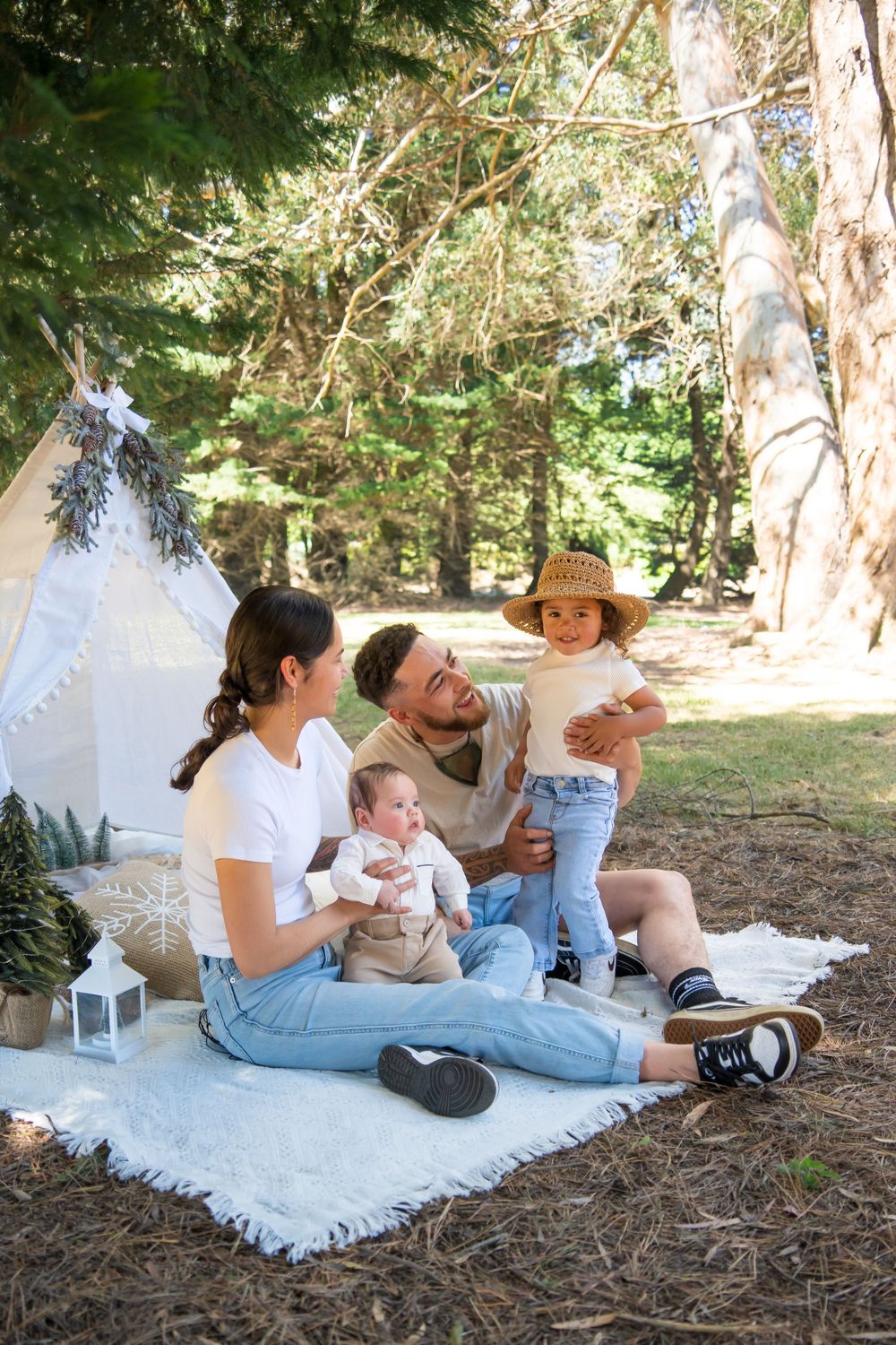 Family of four having Christmas photos taken