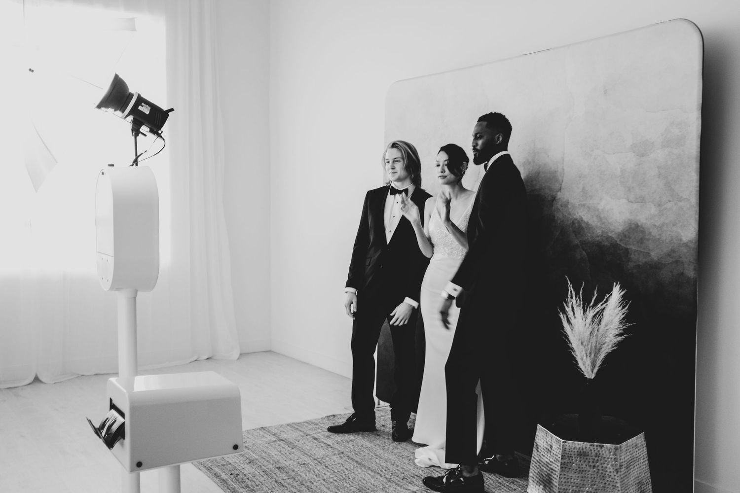 Black and white photo series showing people in silhouette examining artwork on gallery walls.