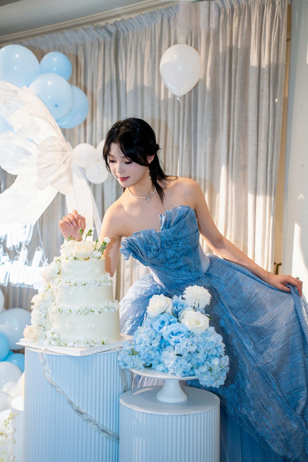 Stunning 18th birthday portrait of a girl in a blue dress at a grand Wintergarden Pavilion event, by Imagine Image Studio.