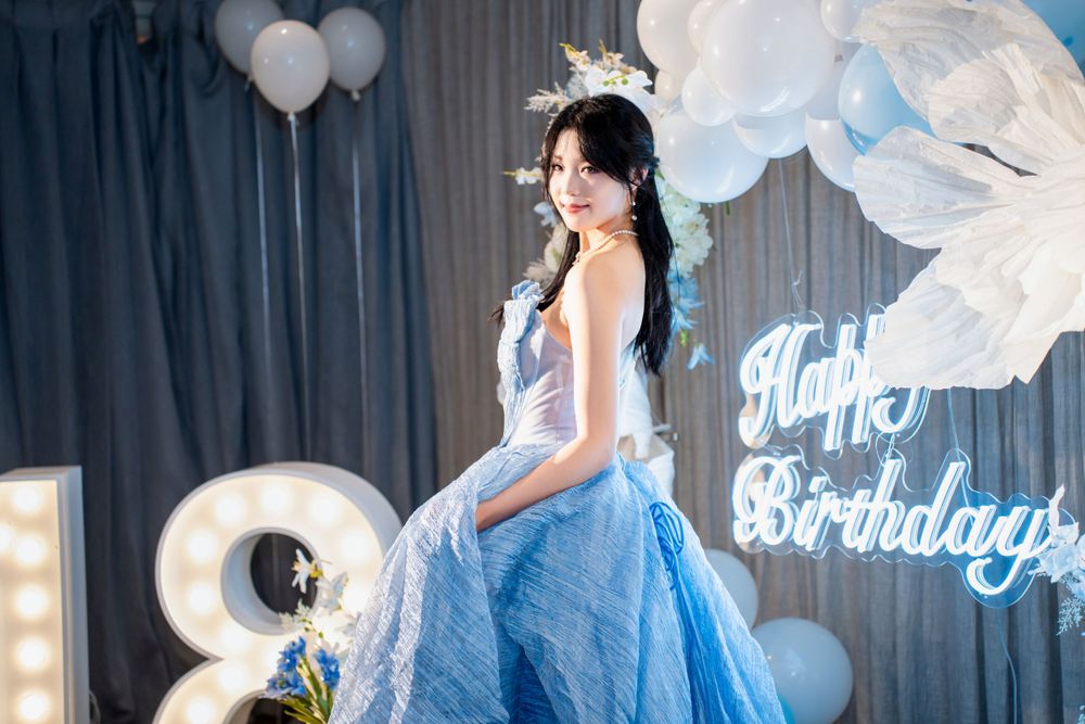 Stunning 18th birthday portrait of a girl in a blue dress at a grand Wintergarden Pavilion event, by Imagine Image Studio.