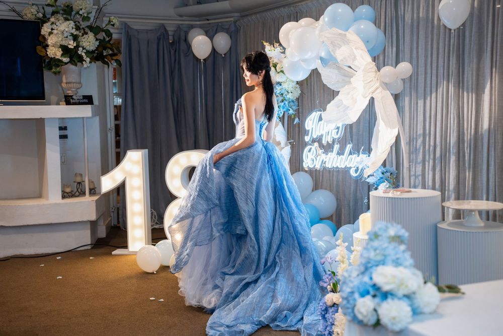 Stunning 18th birthday portrait of a girl in a blue dress at a grand Wintergarden Pavilion event, by Imagine Image Studio.