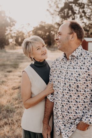Genuine laughter shared between two people during a golden hour portrait session outdoors.