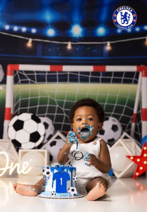 Baby's first birthday cake smash with Chelsea FC theme and soccer decorations.