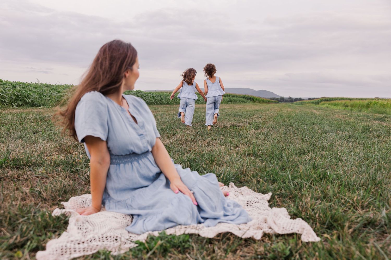 A heartwarming embrace captured during golden hour in a natural outdoor setting.