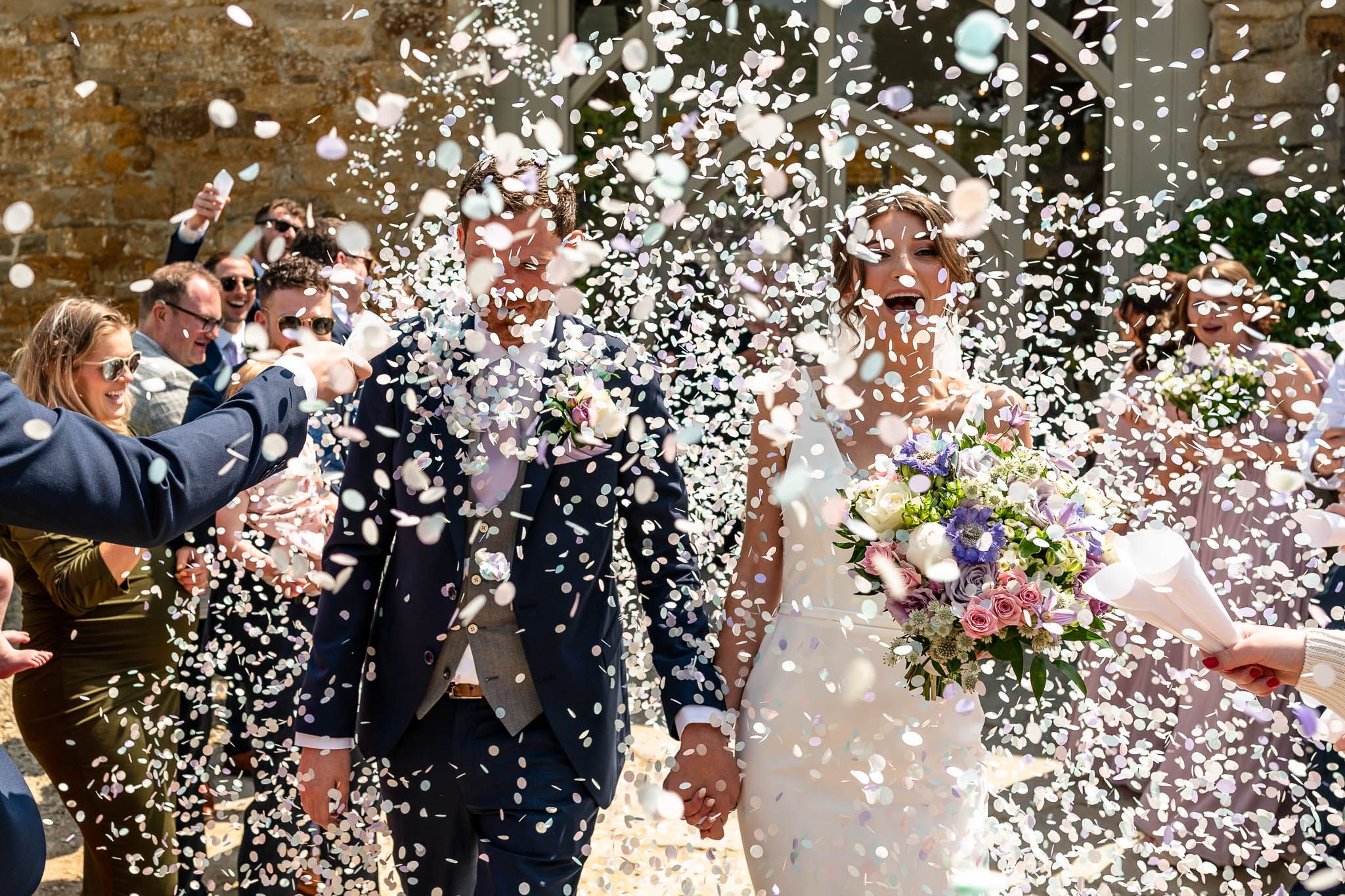 Epic confetti shot Symondsbury Tithe Barn Wedding Dorset.