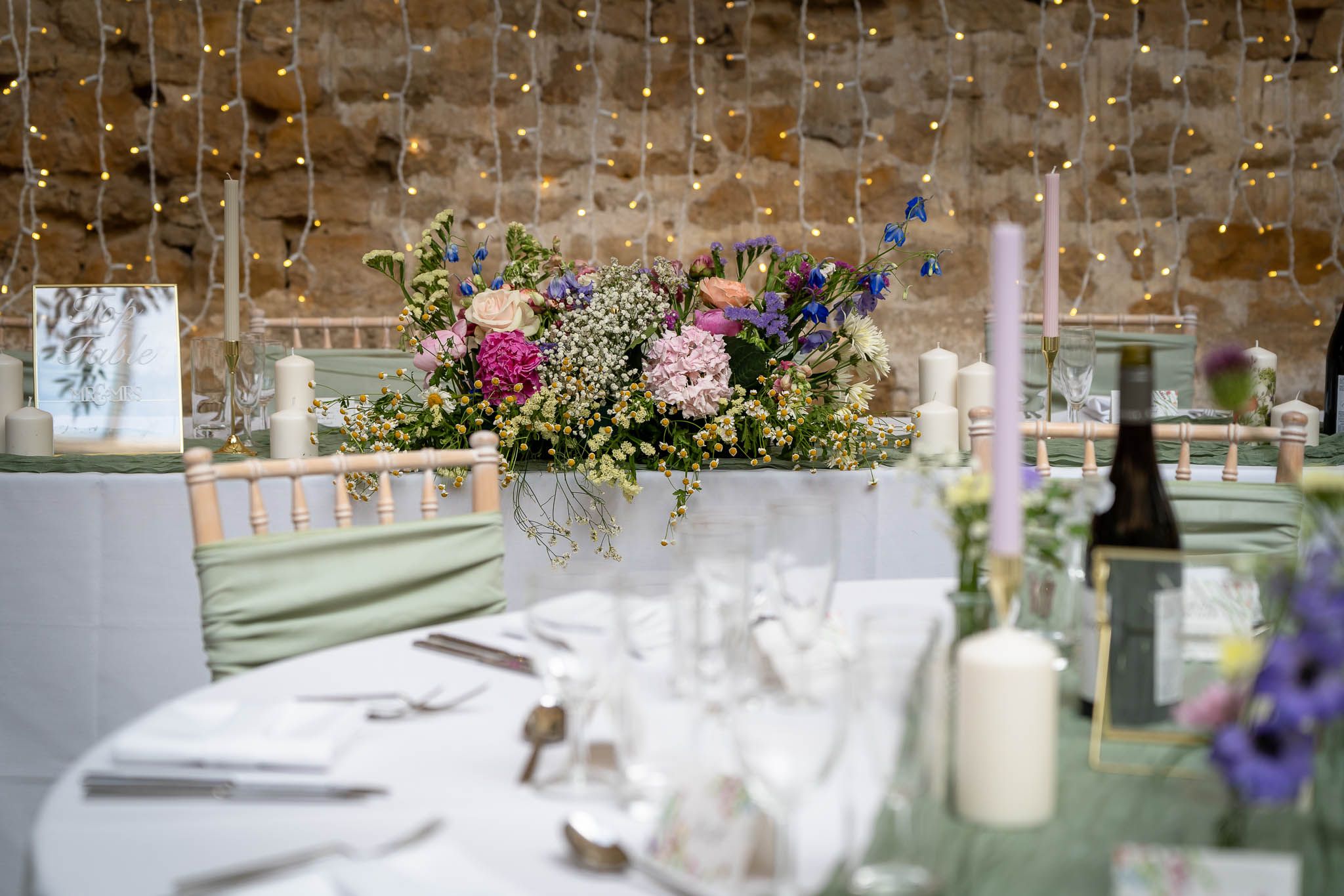 Wedding reception table set up at Symondsbury Tithe Barn Dorset Wedding