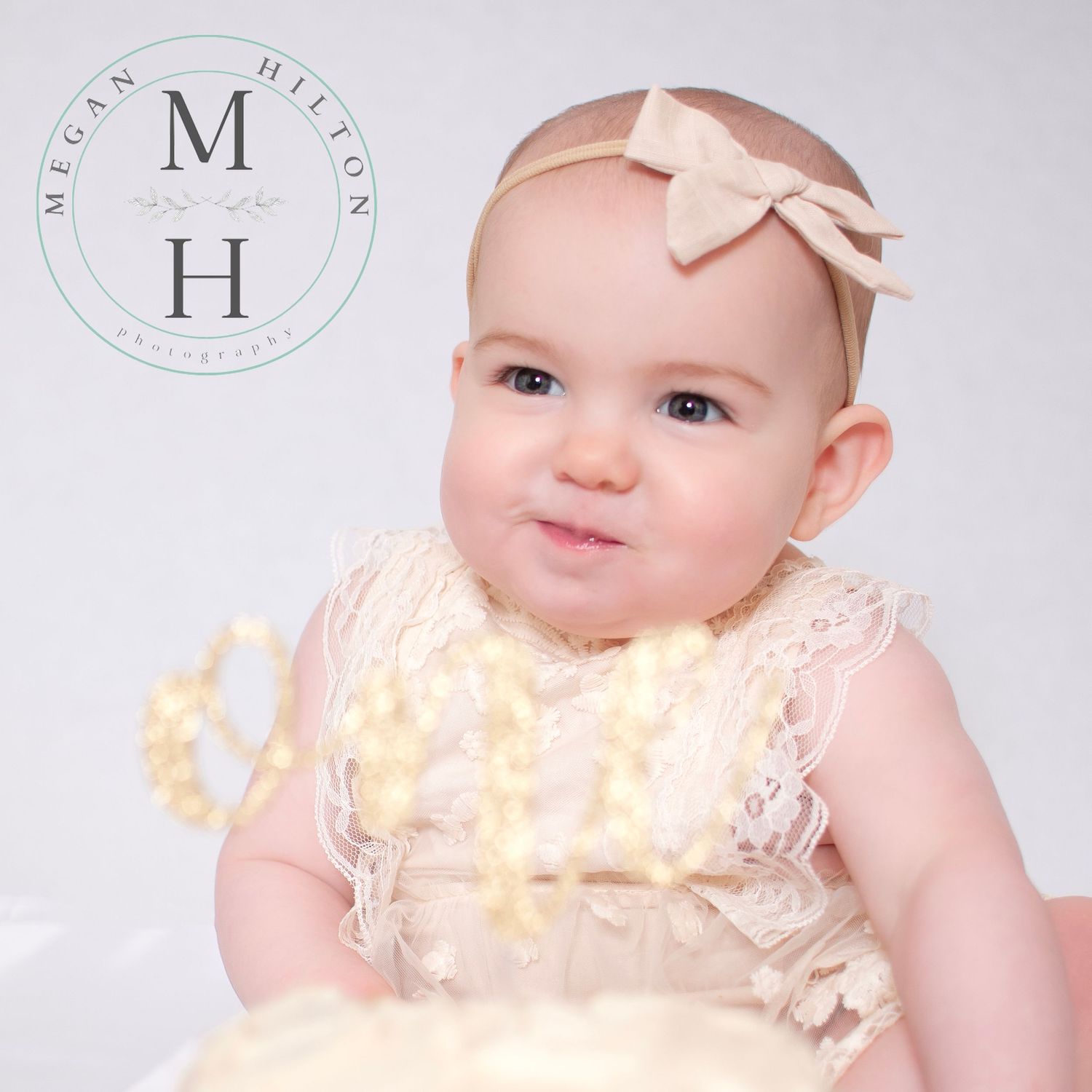 Close up of one year old girl eating cake photo