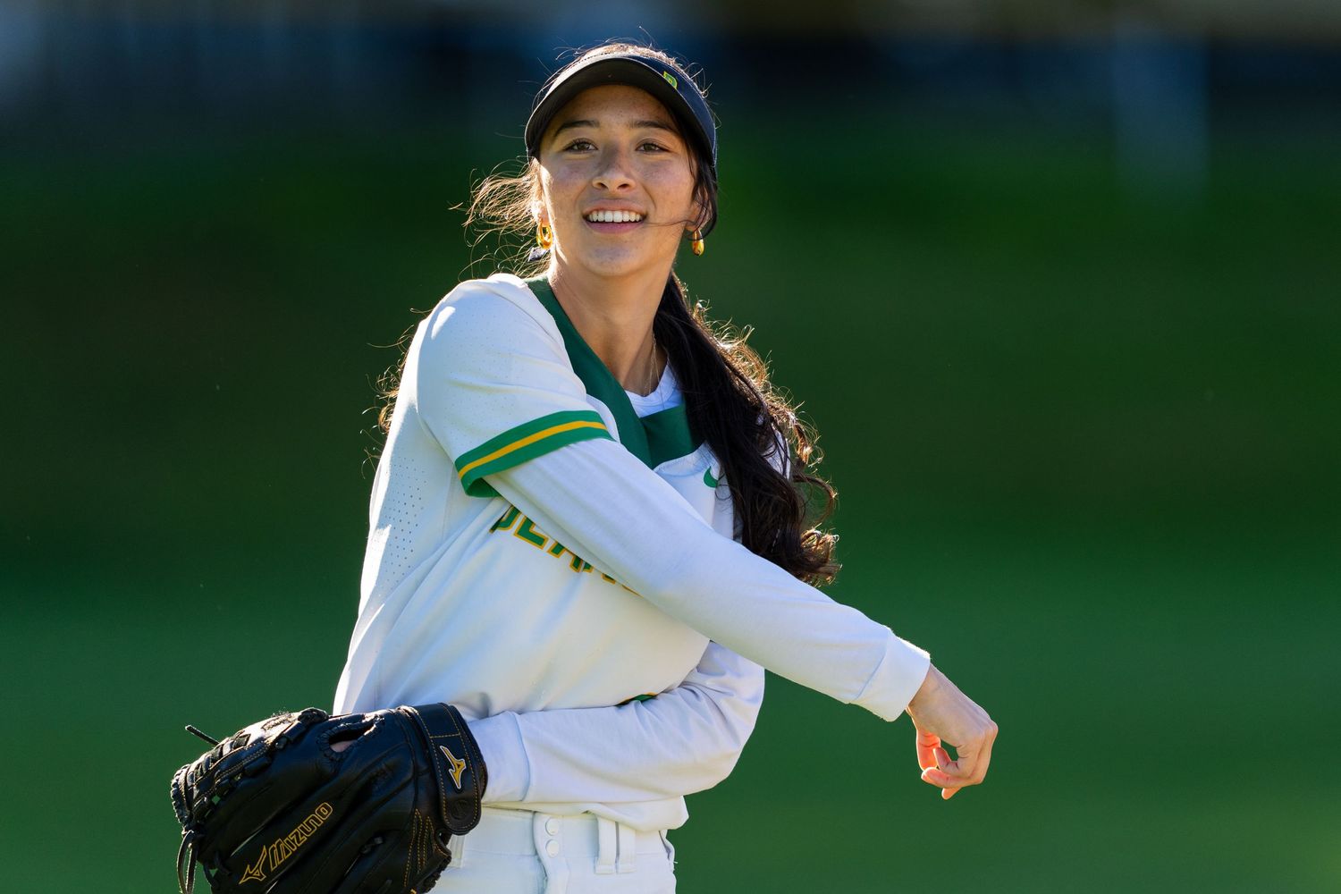 Softball from Bishop Blanchet High School throwing a softball to her teammate.