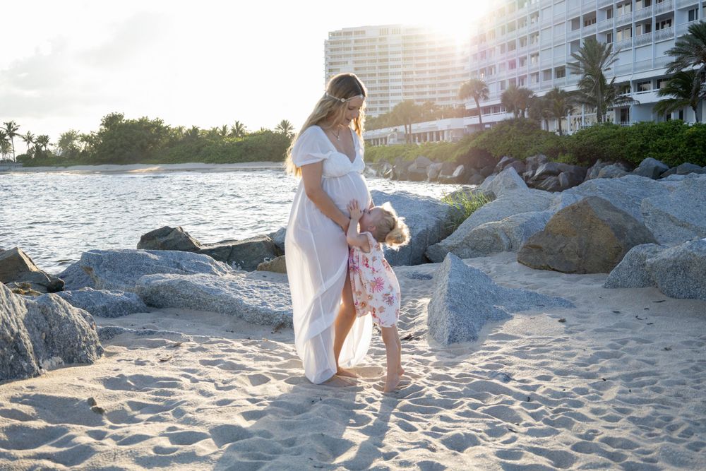 Maternity shoot with toddler at Fort Lauderdale Beach during sunset, taken by Wanderlust Studios