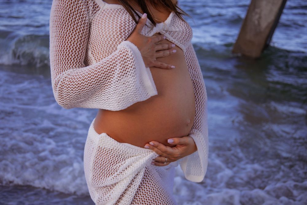 Dramatic pier shot for maternity shoot in Deerfield Beach florida, taken by wanderlust studios