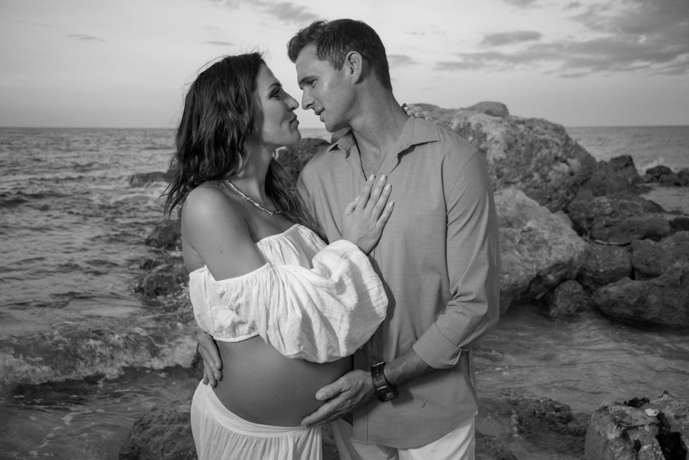 Dramatic pier shot for maternity shoot in Deerfield Beach florida, taken by wanderlust studios, with moody vibes