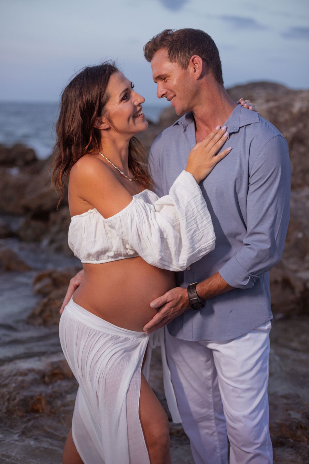 Dramatic pier shot for maternity shoot in Deerfield Beach florida, taken by wanderlust studios, with moody vibes