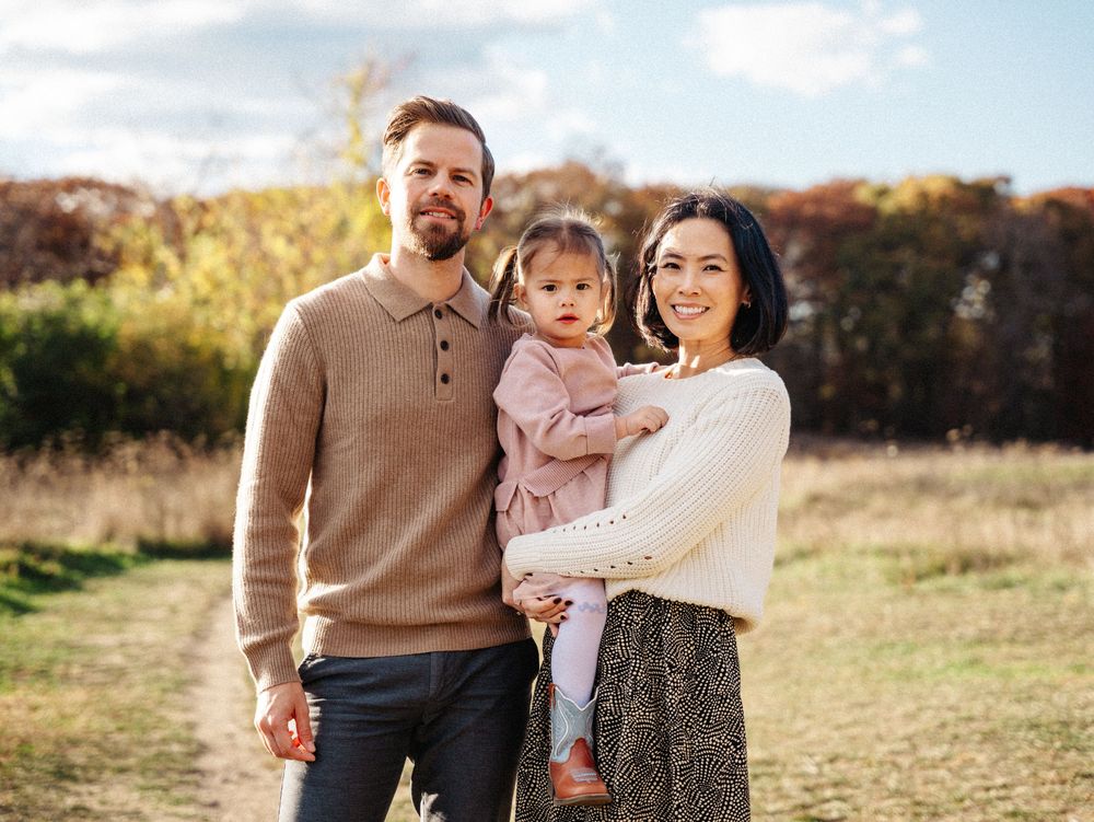 Family portrait session in a golden autumn field with natural sunlight in Belmont, MA.