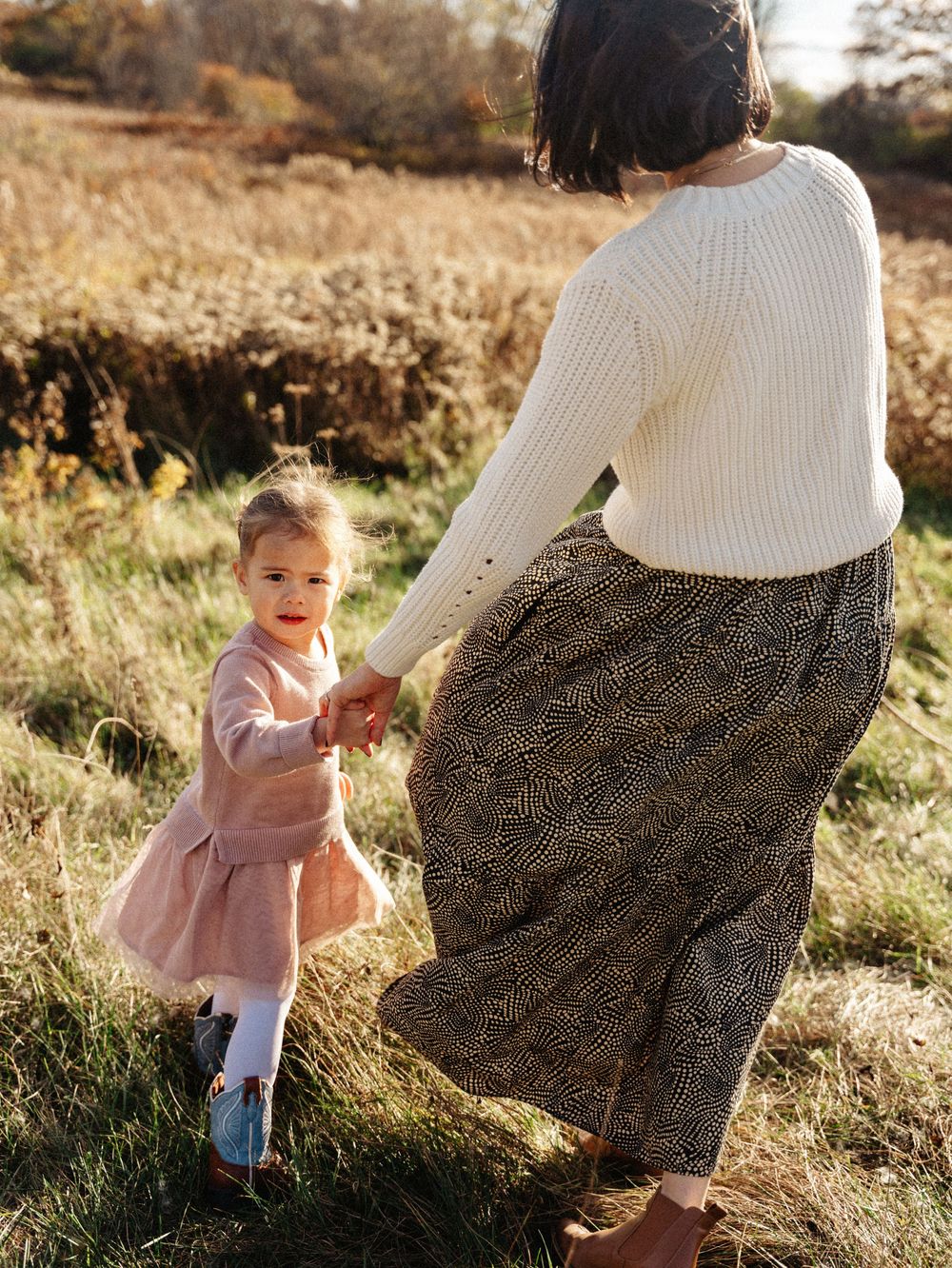 Sweet candid moments captured in a sunlit autumn field Belmont, MA.
