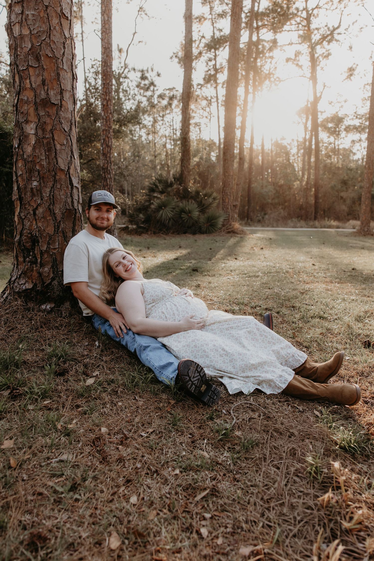 Couple sharing intimate moment while standing in rustic kitchen with wooden cabinets.
