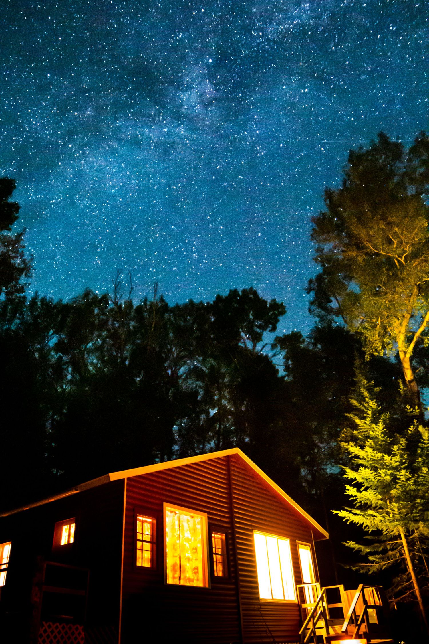 Milky Way over a cabin in Northern Minnesota on the shores of Devil Track Lake