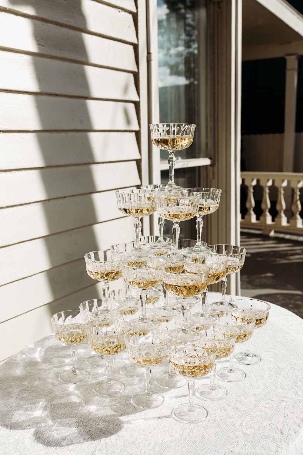 champagne tower reflecting in the sunlight