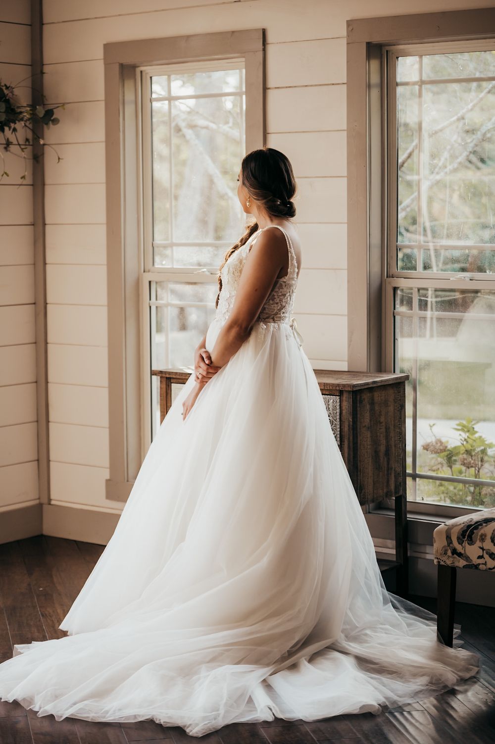 bride looking out of the window before the ceremony