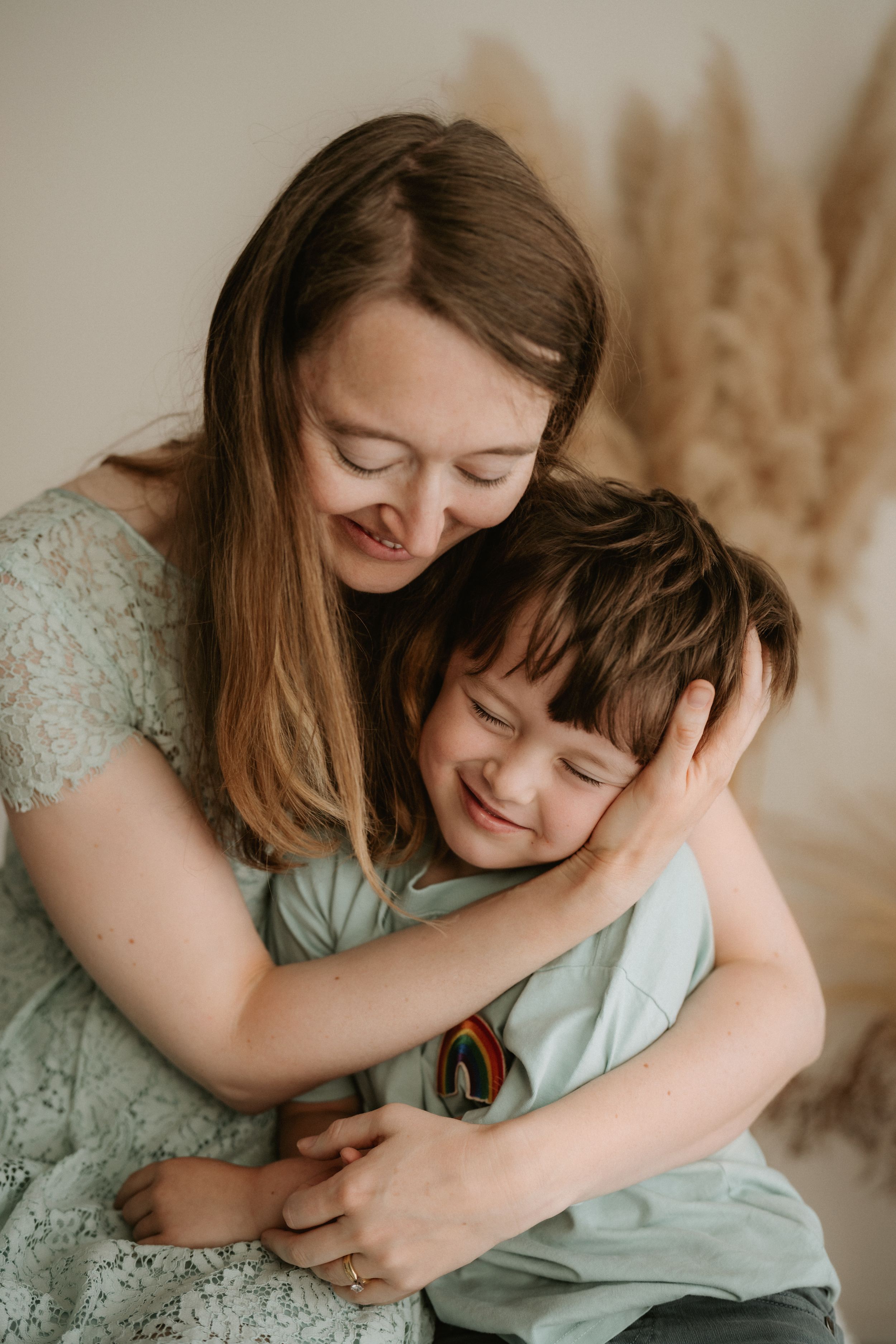 A tender embrace shows two people sharing an intimate moment in soft, warm lighting.