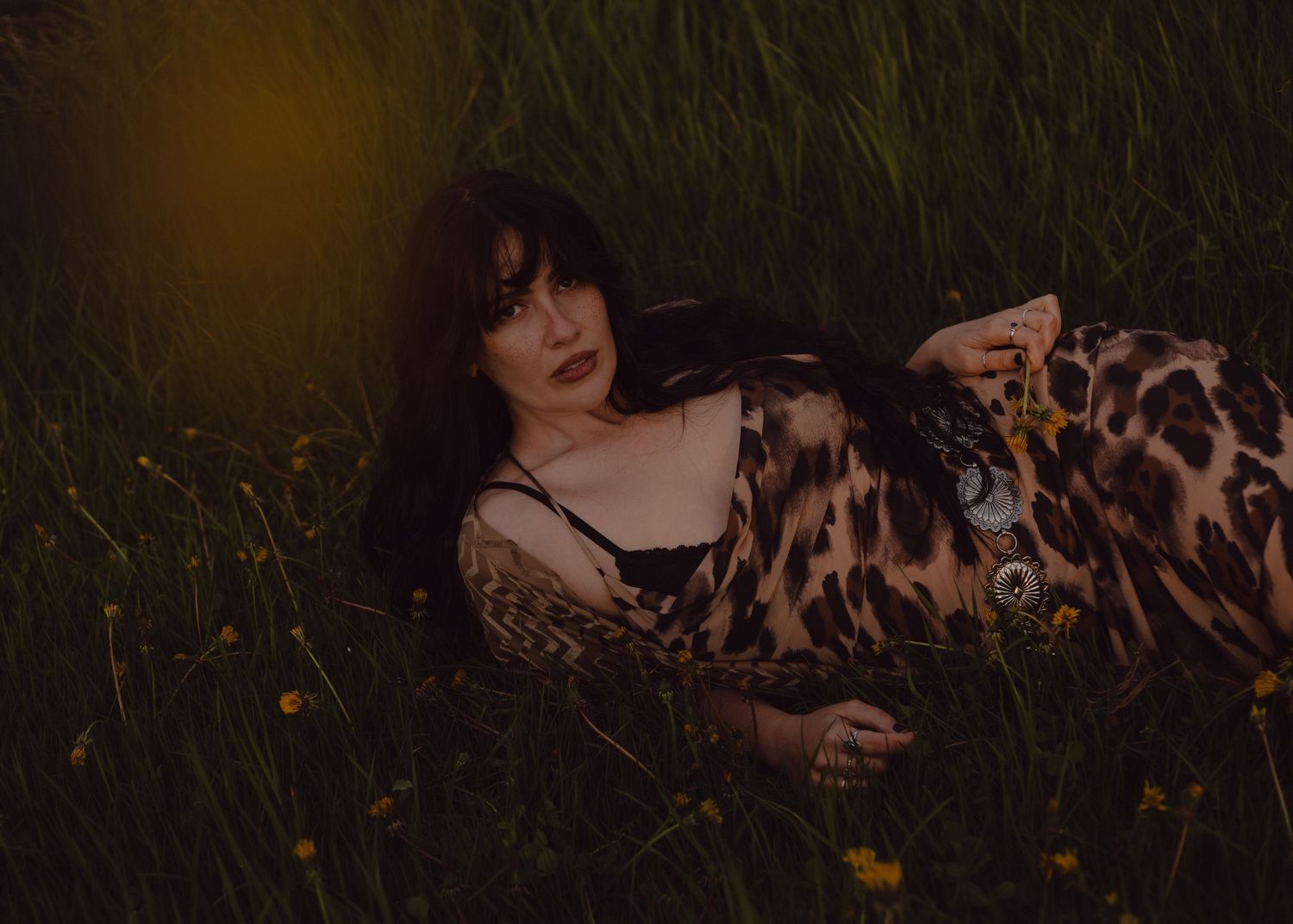 Ethereal portrait of model out in nature while the sun is coming up. The golden rays against her hair.