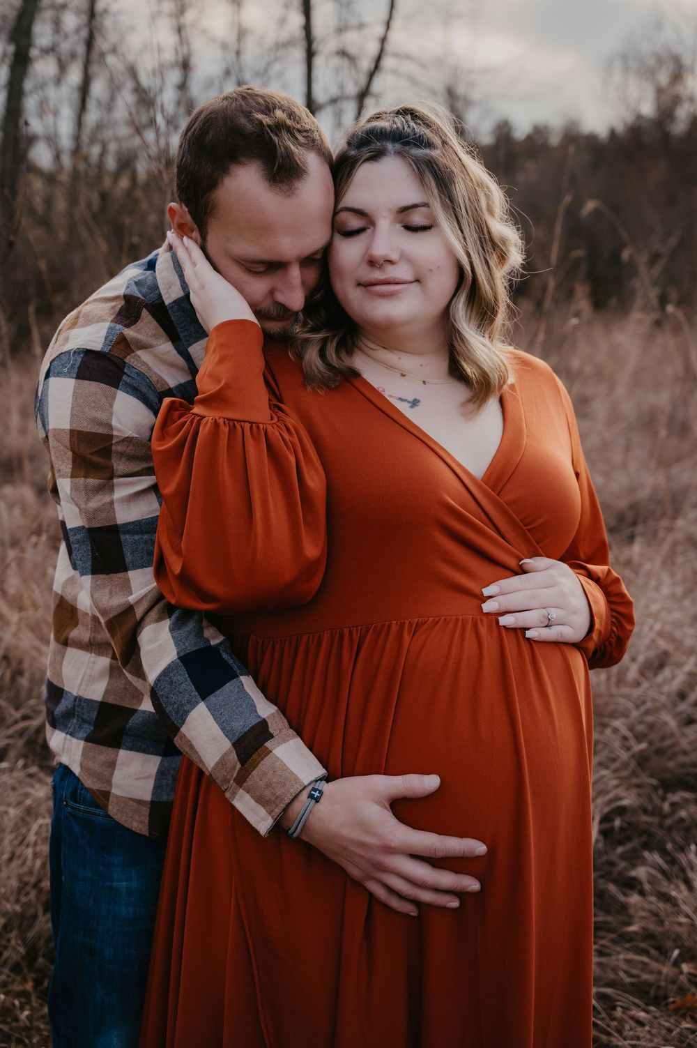 Expecting parents during maternity session outside