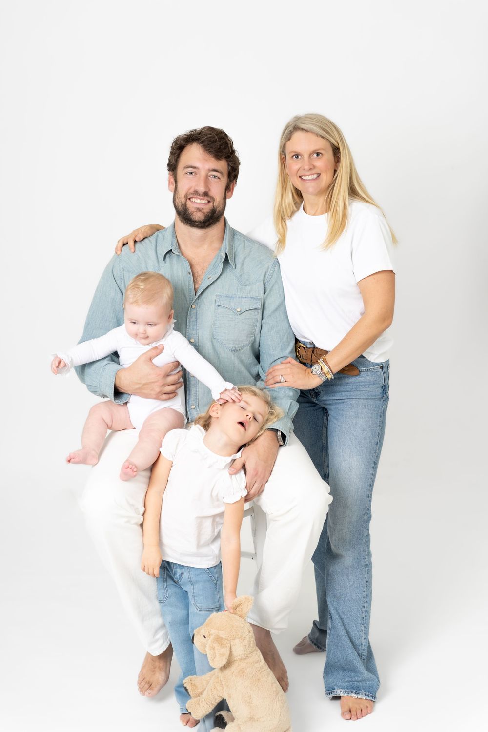 A family photo sequence showing playful moments with a baby against a white studio background.
