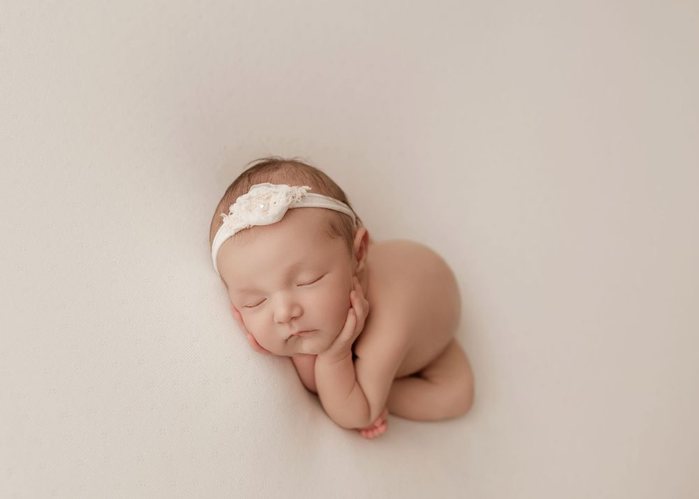 Series of peaceful newborn portraits in soft neutral tones showing different poses on textured blankets.