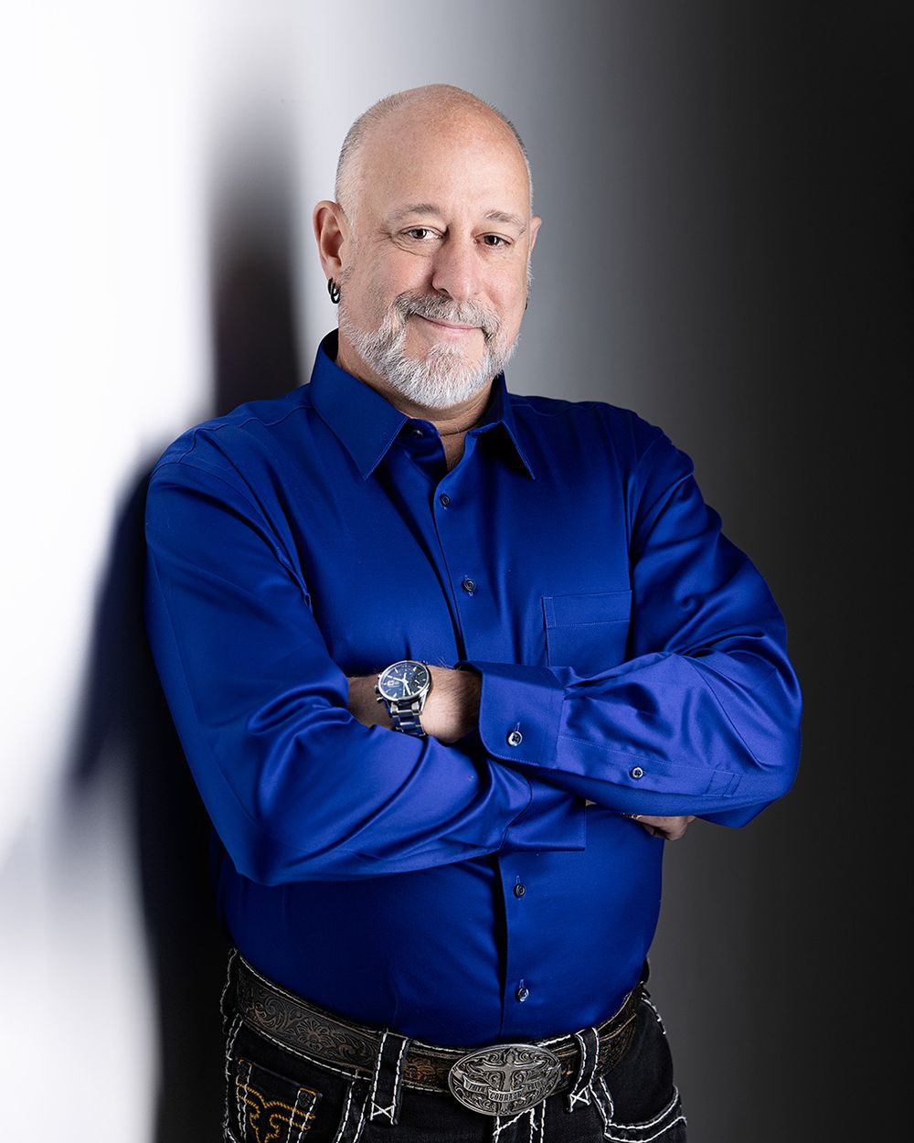 Professional headshot photographer in Atlanta capturing corporate portrait of confident male executive in studio