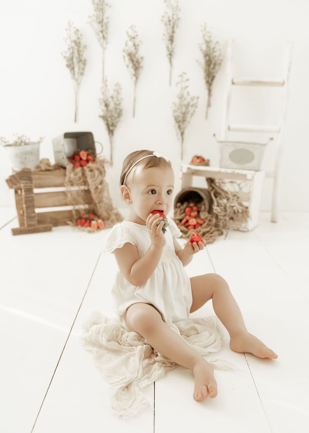 Soft and bright studio photo setup with pampas grass, wooden crates, and tomatoes creating a rustic autumn scene.