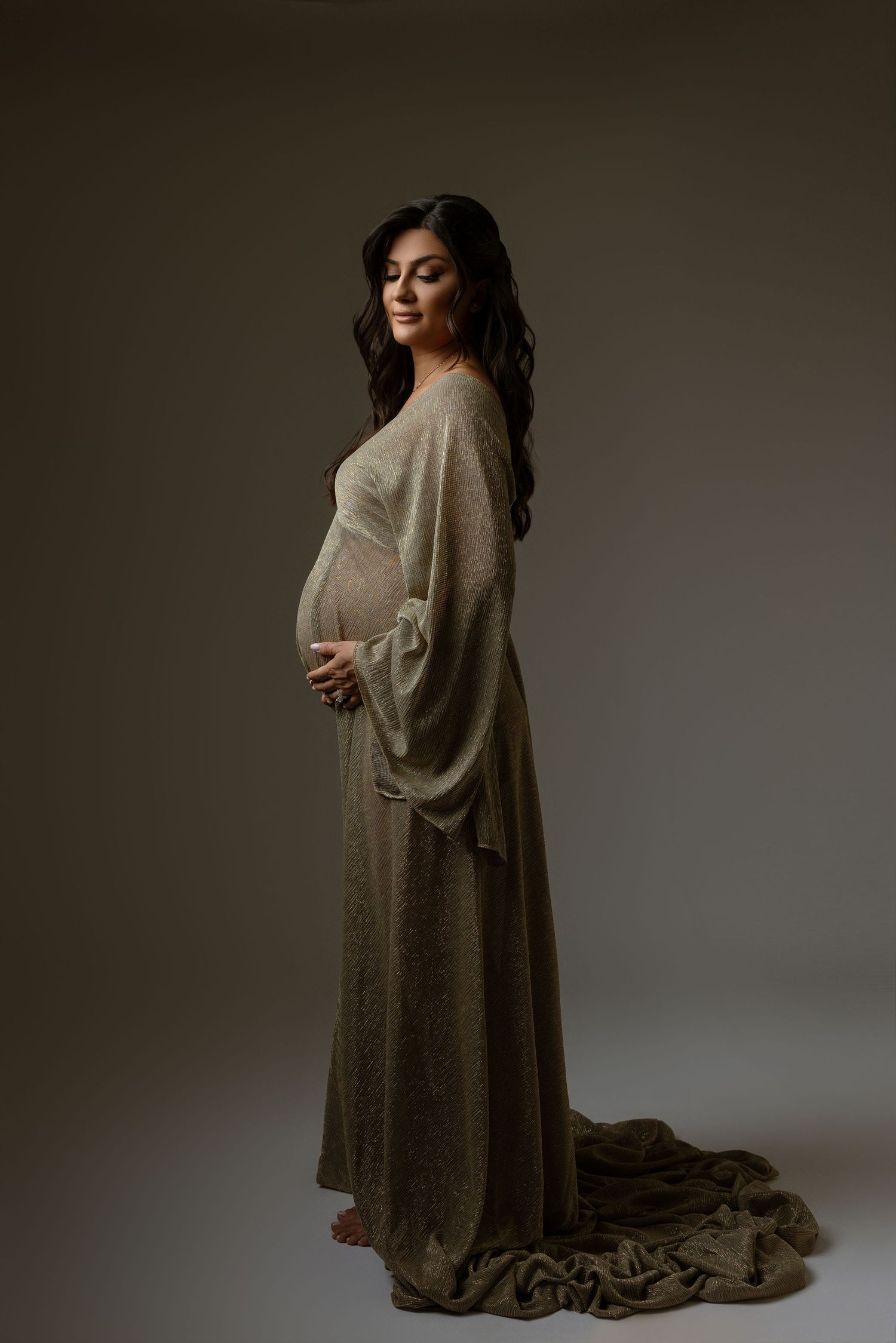 Expecting mother posing in a beautiful maternity gown in Santa Clarita