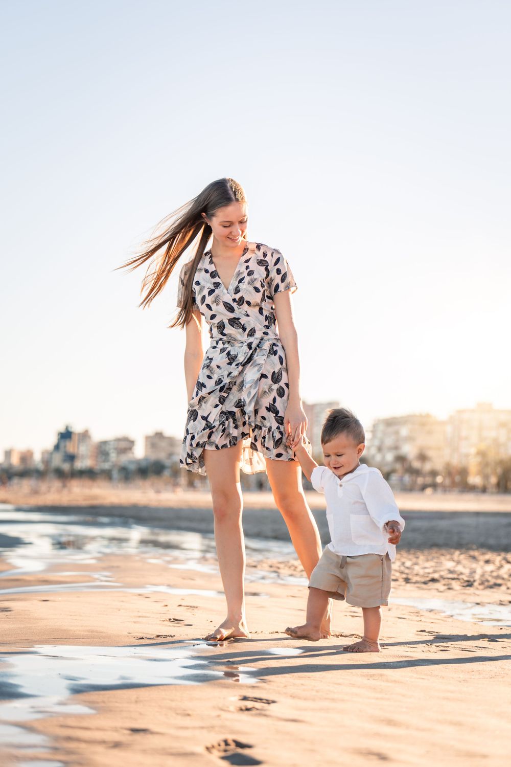 mom and son playing in the water in Playa de San Juan Alicante