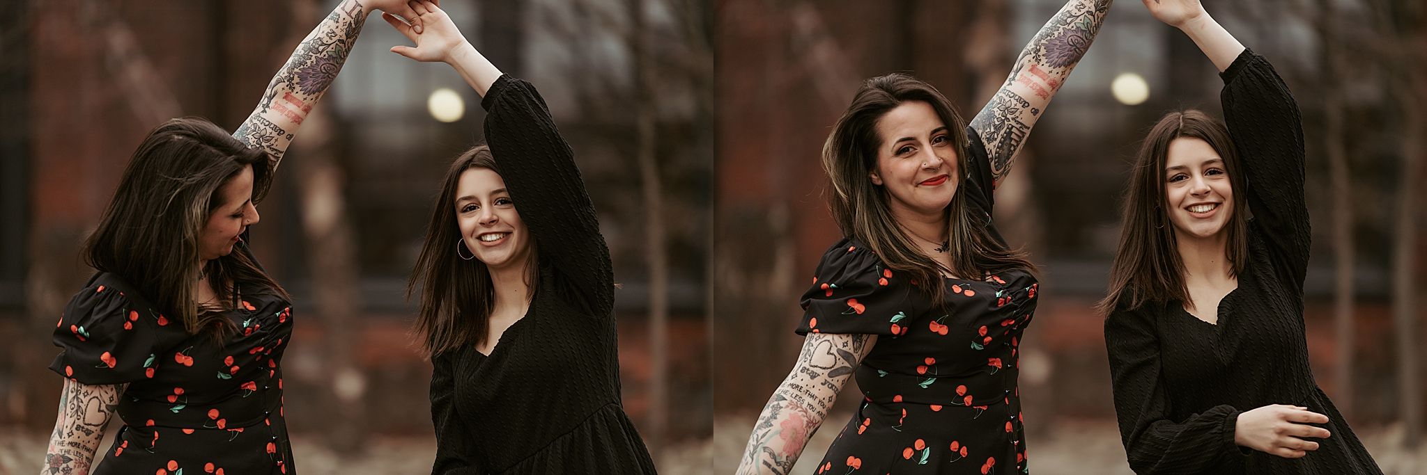 Two women in black dresses laughing and twirling together in a romantic autumn setting.