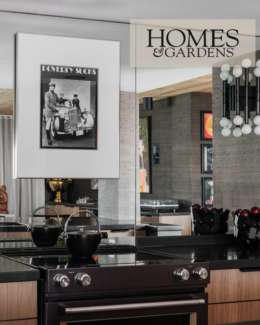 Kitchen back splash made of mirrored tiles, with black and white photo art in the center