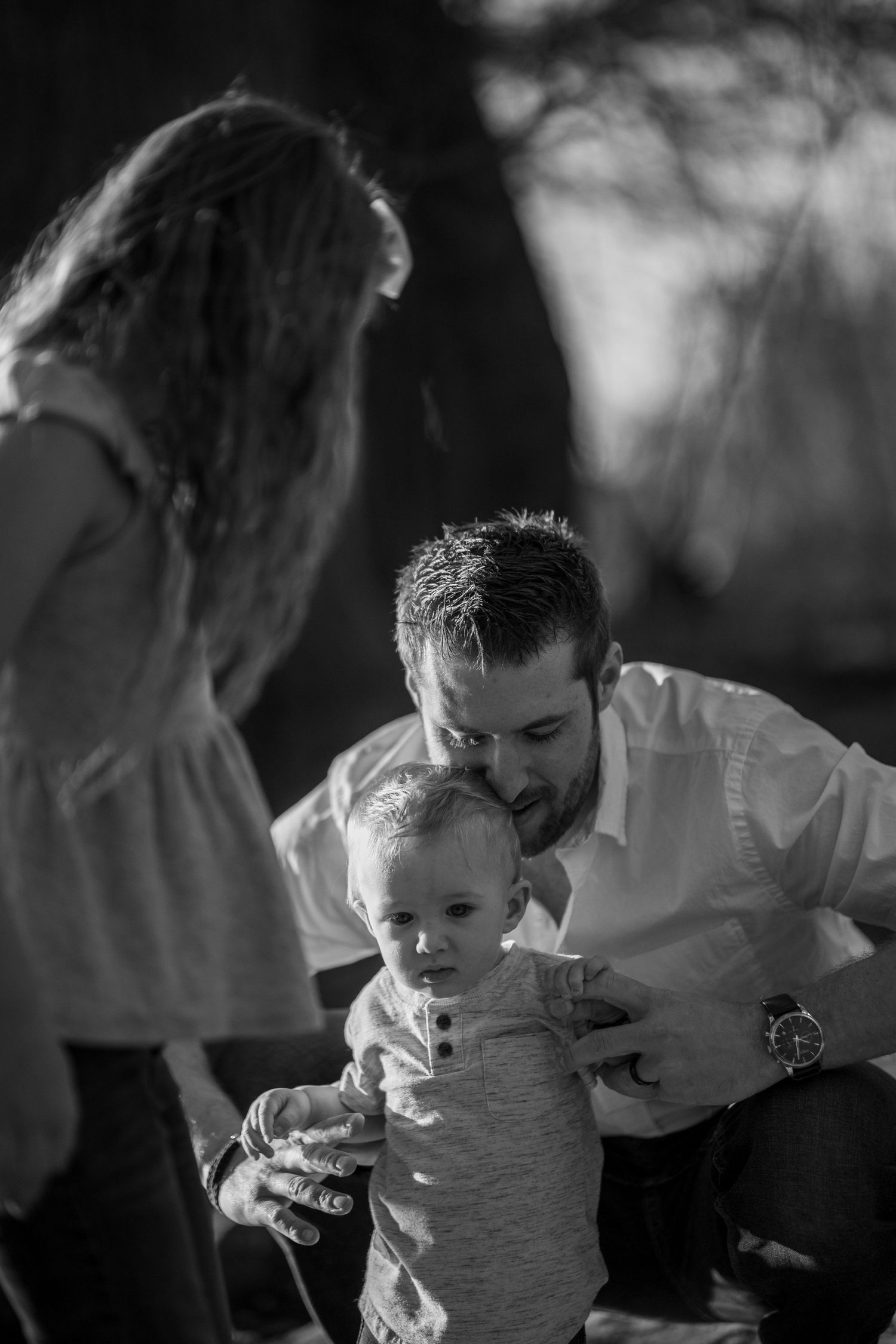 father holding his child family portraits