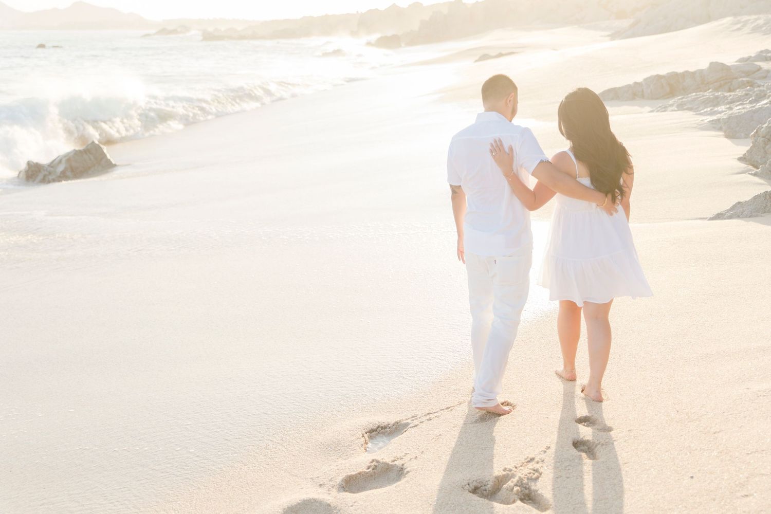 Love at Los Cabos, couple walking by the beach at The Cape hotel