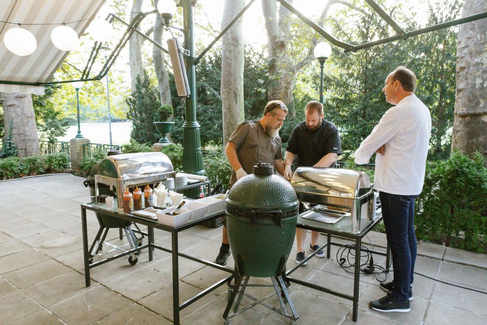 Outdoor cooking demonstration with a Big Green Egg grill setup.