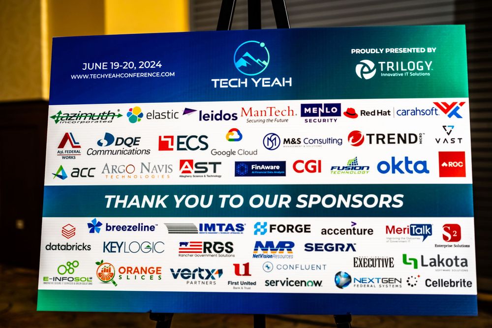 Sponsor recognition board displaying multiple technology company logos and partner brands.