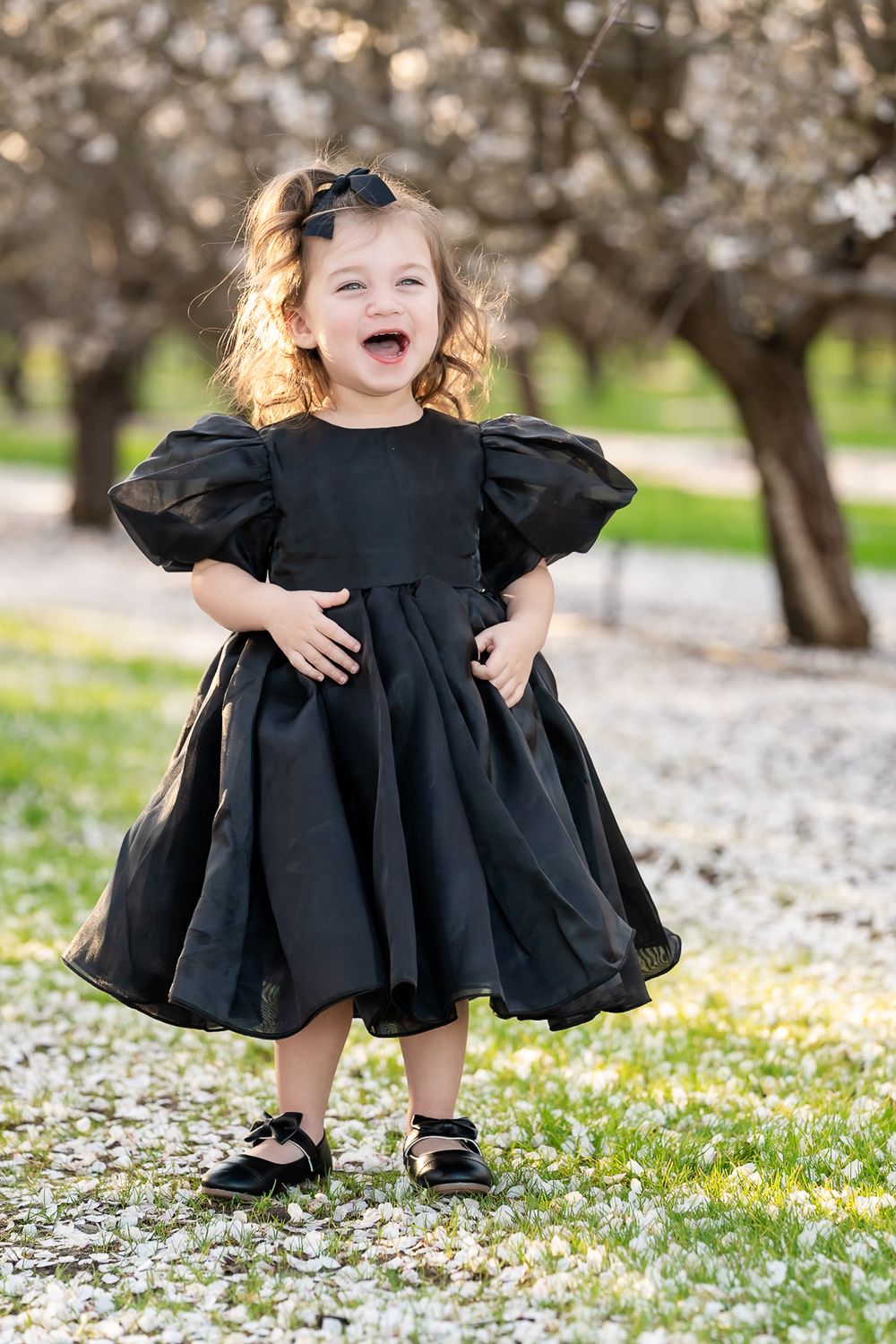 Playful photography admist blooming flowers, Tracy, CA. fun and laughing moments captured beautifully