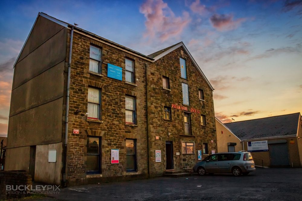Photograph of the Dance Kingdom building in Llanelli, with a lovely early sunset in the background.