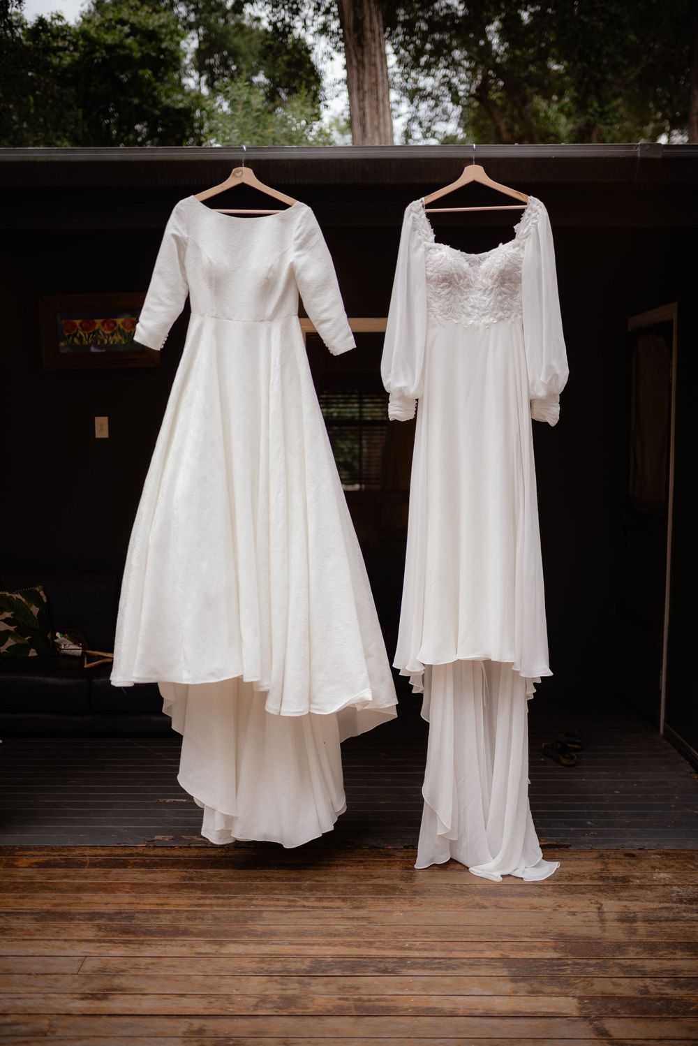 Bride and Bride wedding dresses hanging next to each other