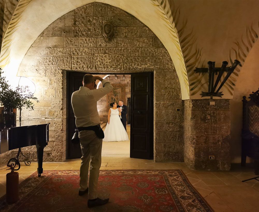 Wedding photographer Alan Harbord photographing wedding couple in historic house