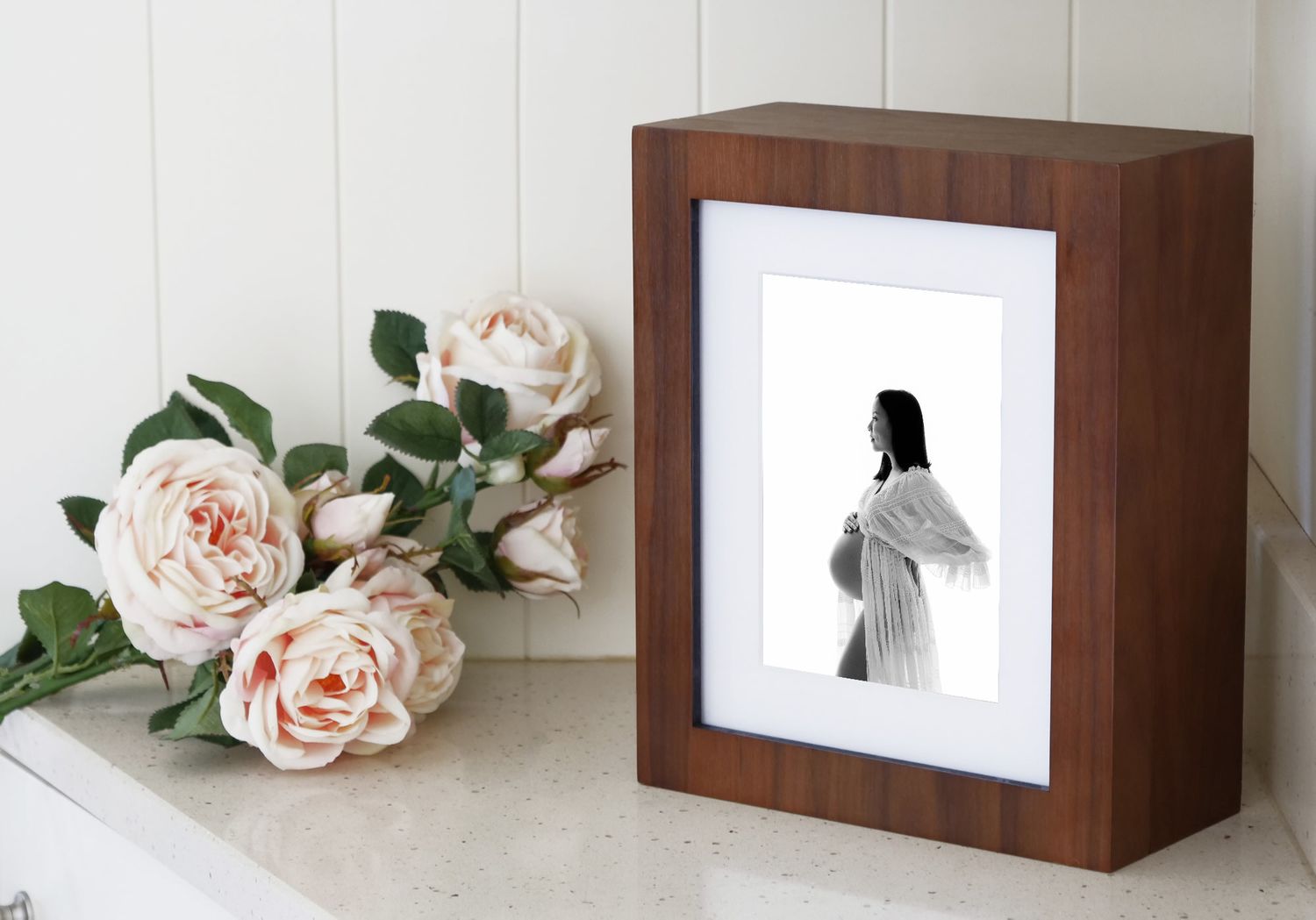 wooden window folio box with a matted print of a pregnant women in a white maternity dress