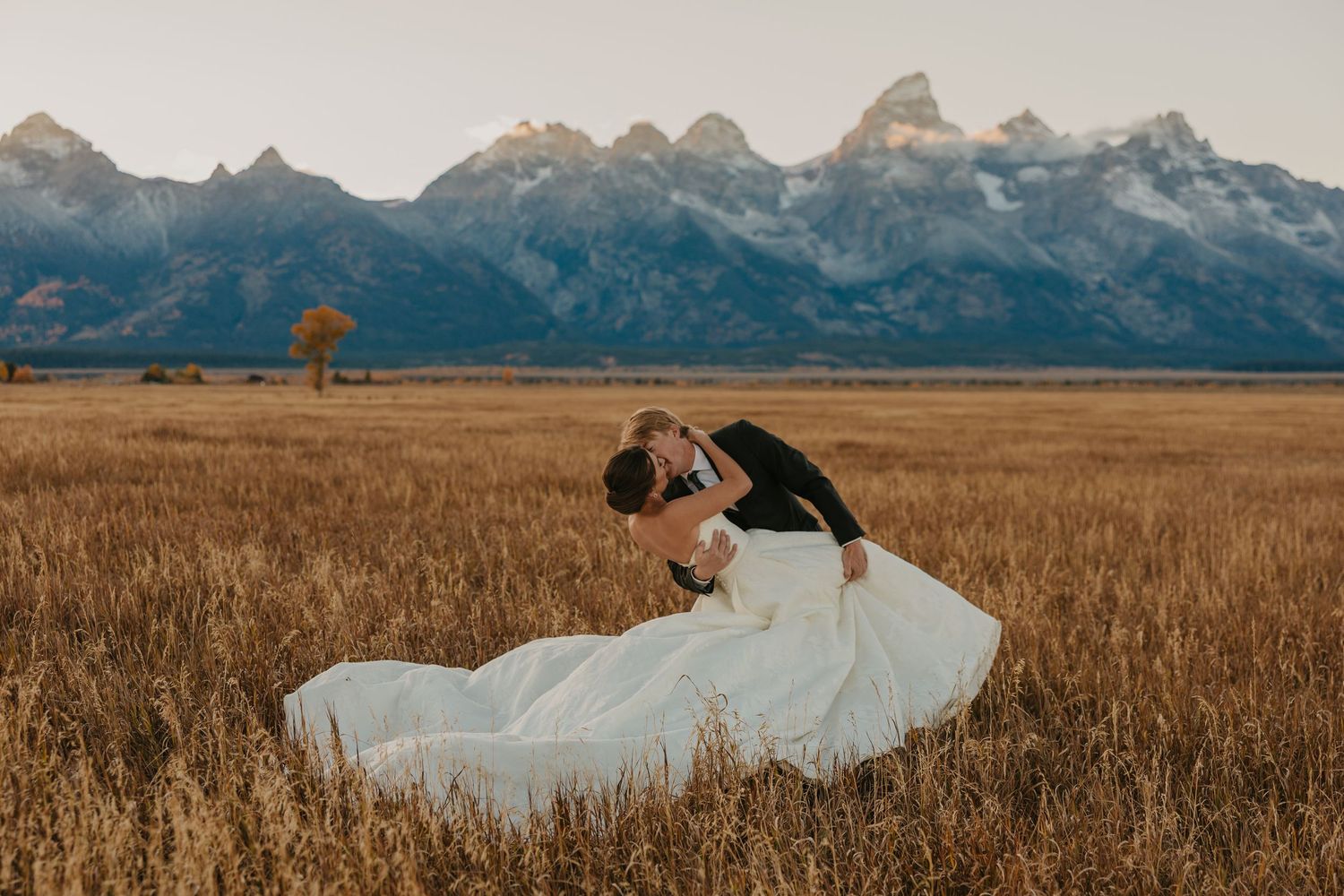 A Grand Teton Elopement Photographer captures a Grand Teton Elopement at Mormon Row in the fall. Grand Teton National Park
